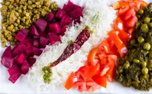 Colorful vegetarian platter with curry, lentils, rice, and salad
